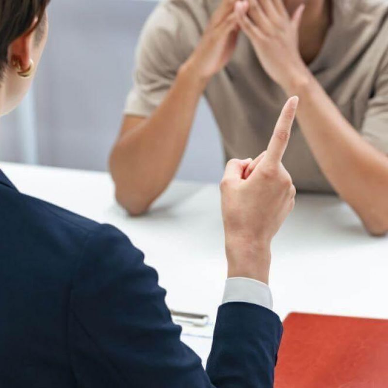 Man and woman discussing deportation case with a lawyer