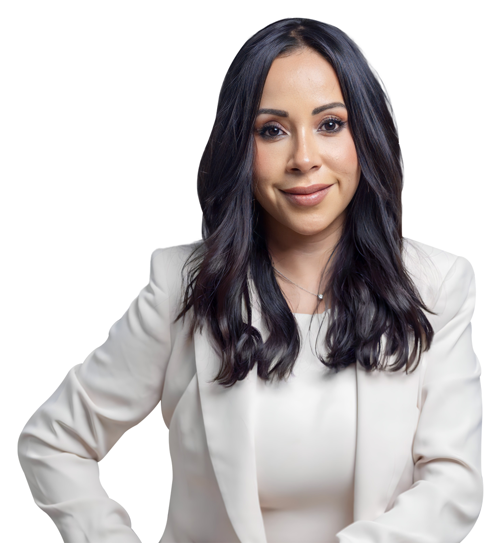 Maria Monclova in a white blazer with dark hair, professional portrait on a white background.