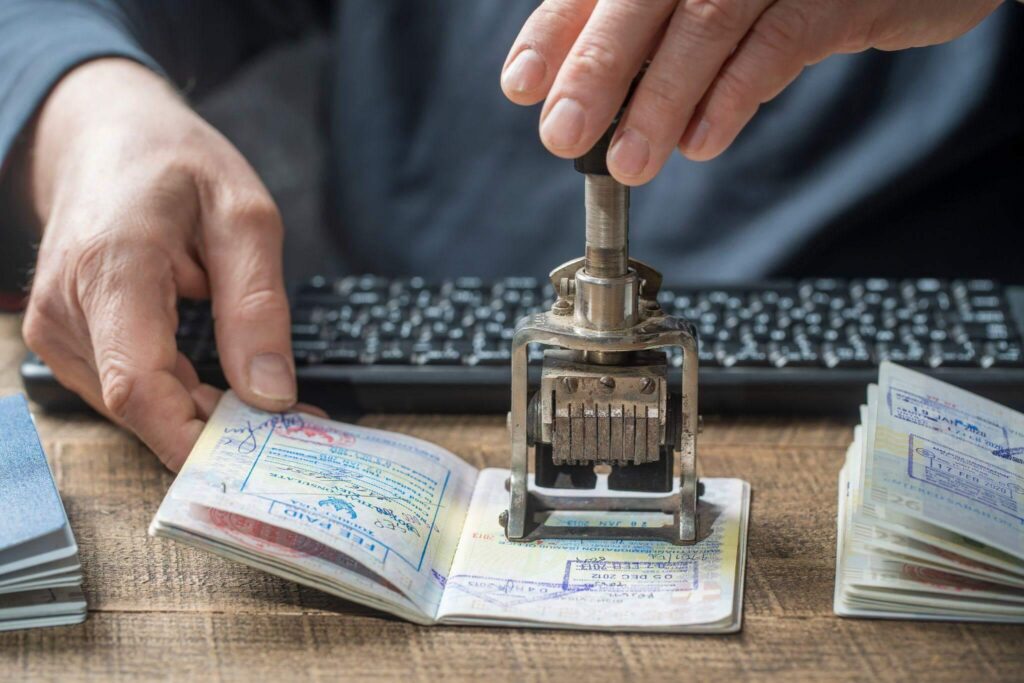 a person is working on a stamper on a desk